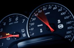 Sporty Speedometer. Sports Car Instruments Dash/Panel Closeup. RPM and Speed Metering. Transportation Photo Collection.
